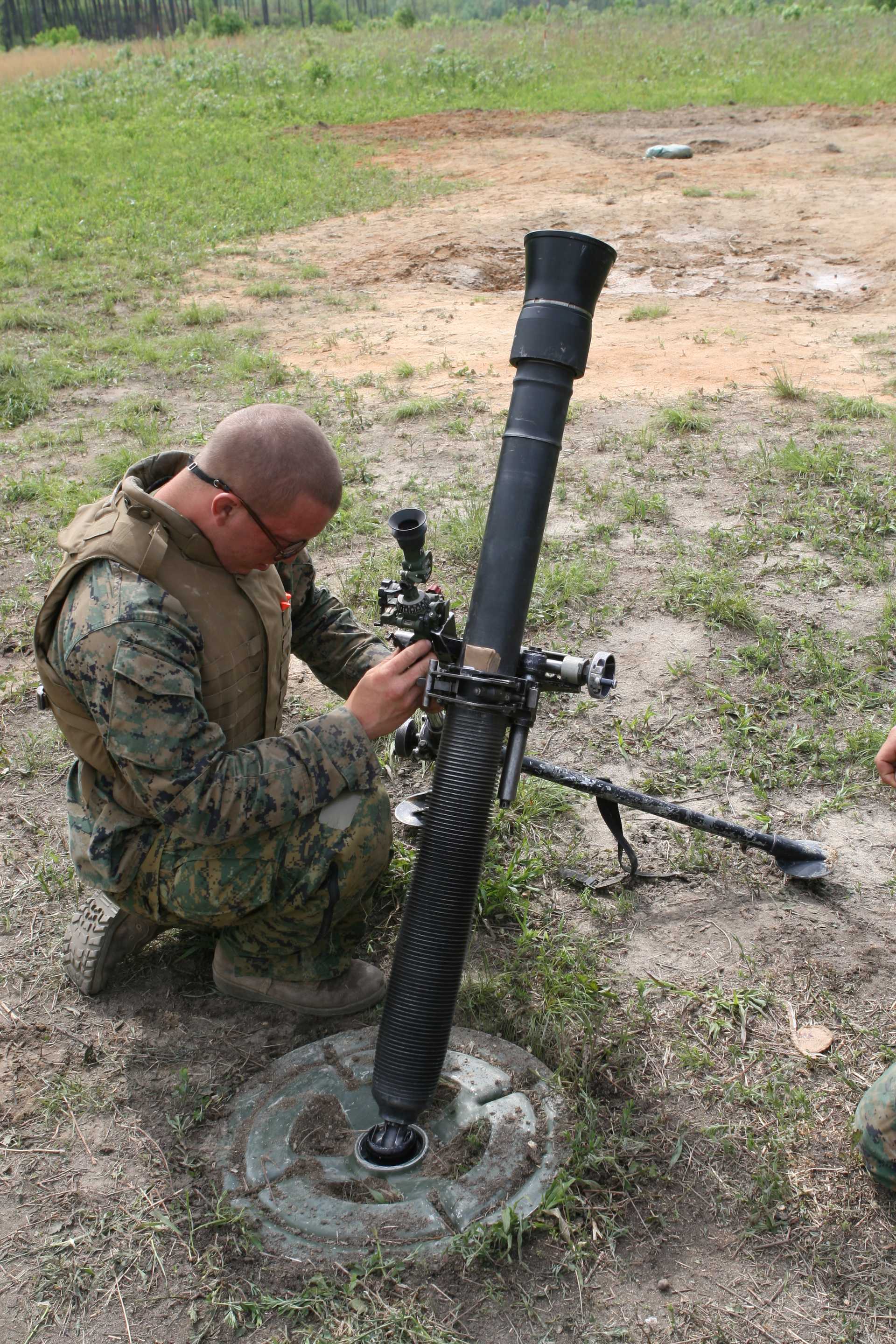 Picture of a soldier setting up an M252 mortar